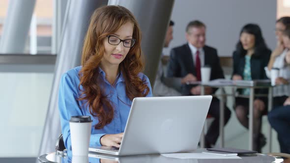 Young businesswoman working on laptop computer