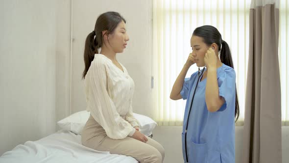 Female physiotherapist touch on back for checking backbone injury alt