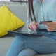 Young Woman Is Making Online Payment Holding Bank Card Using Modern PC Tablet at Home Sitting on - VideoHive Item for Sale