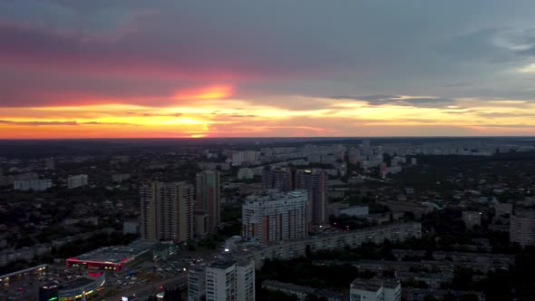 Epic aerial sunset in city residential district