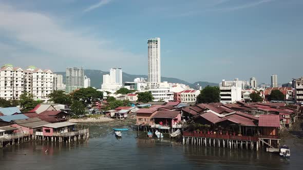 Aerial view fly towards wooden bridge at seashore at Georgetown Penang. alt