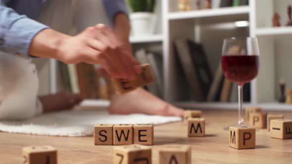 A Girl Sits On The Floor And Adds The Word Sweet Home From The Letter, The Concept Of A Happy alt