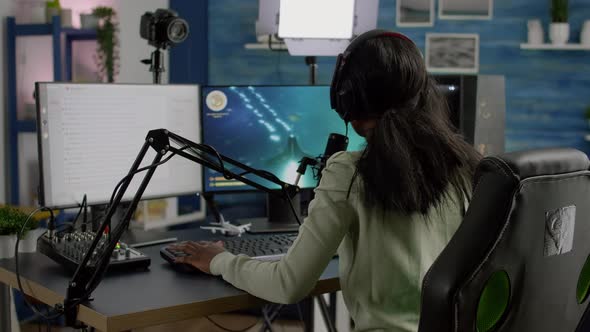 African Woman Streamer Cyber Winning Performing Space Shooter Video Game alt