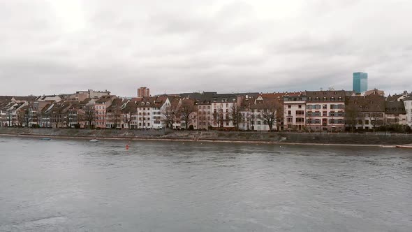 Rhine river against riverside Basel cityscape,  Switzerland. Charming aerial scenic view alt