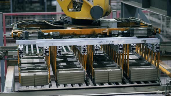 Factory Industrial Machines Work with Bricks, Moving Them. alt