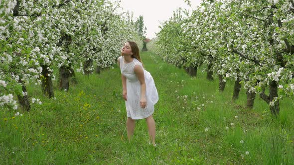 Girl dancing in the orchard alt
