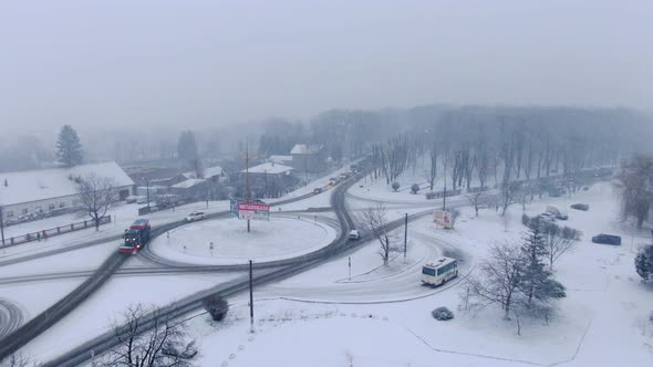 Aerial view of small town in snowfall. Blizzard. Snowstorm.