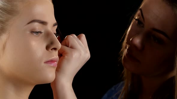 Cosmetic Beauty Procedures and Makeover Concept. Makeup. Black. Closeup alt