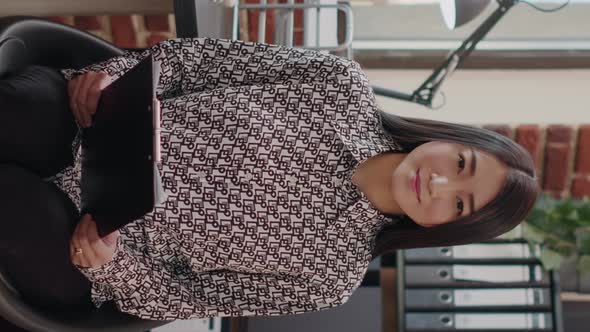 Vertical Video POV of Business Woman Talking on Video Call in Office alt