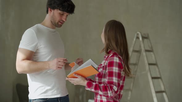 Family Couple Discussing a Renovation of a Home with Color Palette alt