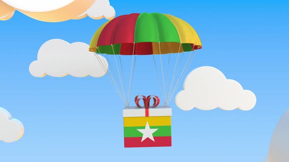 Carton with Flag of Myanmar Falls with a Parachute alt