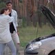 Slim Woman Rolling Up Sleeves Walking to Open Car Hood Pushing Away Man - VideoHive Item for Sale