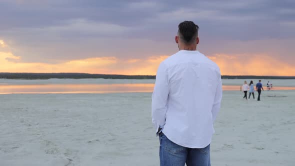 Brutal Man Walking on Beach