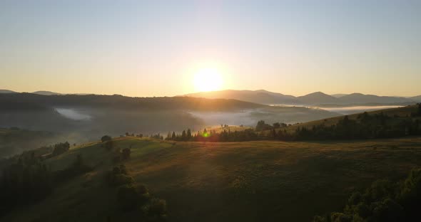 Fog In The Carpathian Mountains. Sunrise Over The Mountains