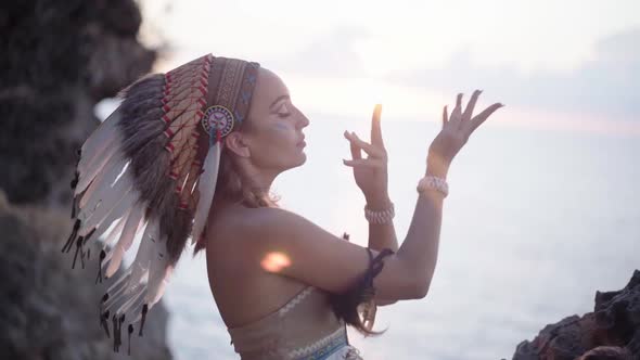 Cinematic Portrait of Majestic Dancing Woman and Sunbeams Wild Shamanic Ceremonial Dress Wearing alt
