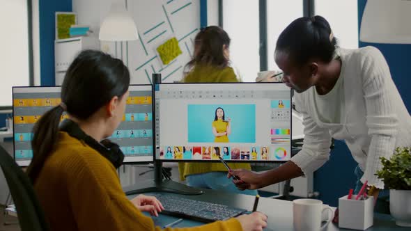Diverse Photo Editors Sitting in Creative Workplace Retouching Photos alt