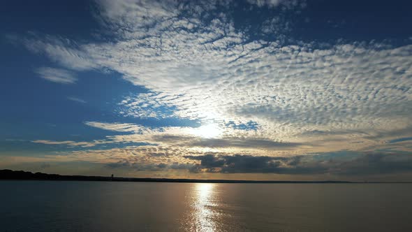 Beautiful Cloudscape Over the Sea Sunset Time Lapse alt