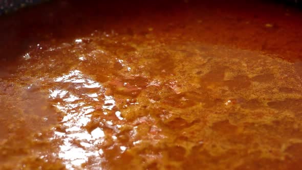 Red spicy soup boiling