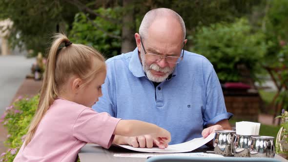 Elderly Man and Small Child