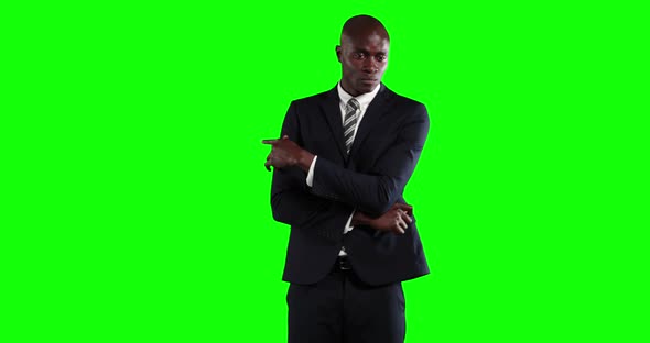an African American man in suit in green background