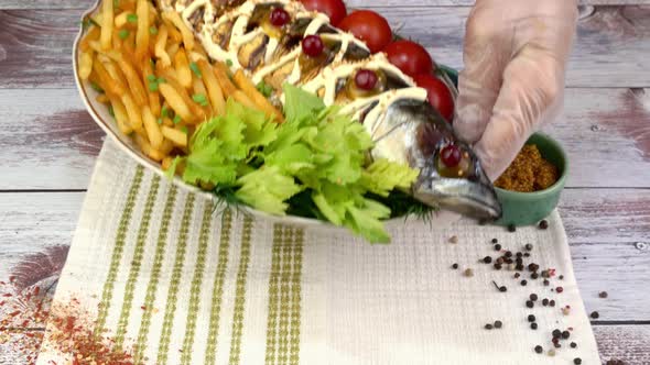 Fried Mackerel Fish with French Fries Tomatoes and Celery Leaves Mustard and Ketchup alt