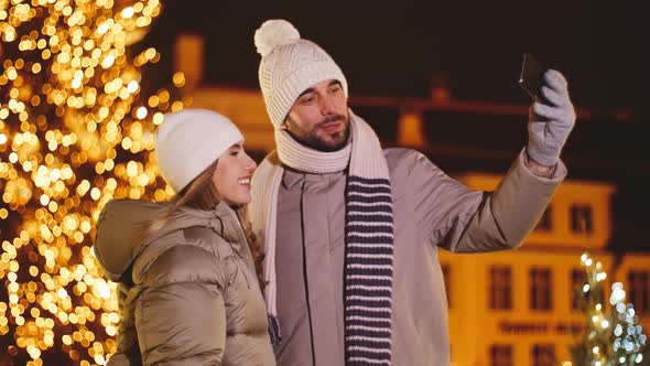 Happy Couple Taking Selfie in Christmas City