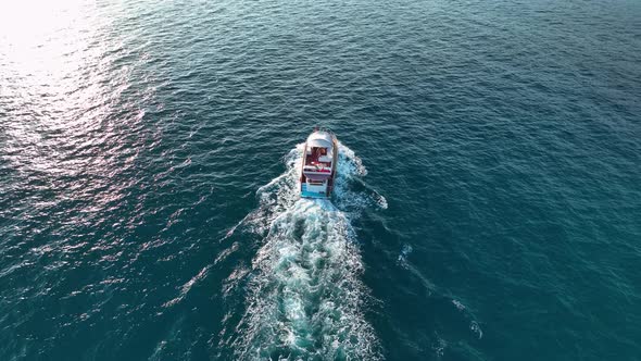 Luxury yacht sails to the port aerial view 4 K Turkey Alanya alt