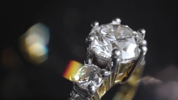 Extreme Detailed of Diamond Ring Close Up Shot While Rotating on Dark Background alt