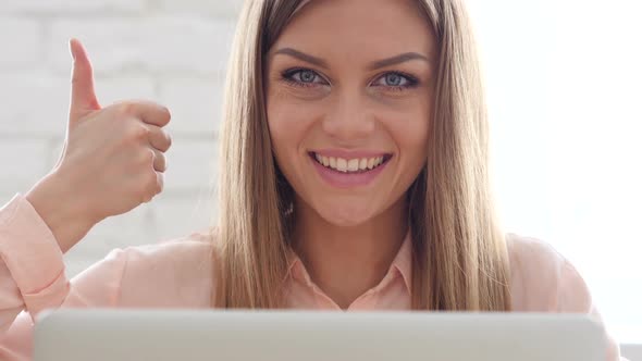 Thumbs Up by Confident Designer Woman alt