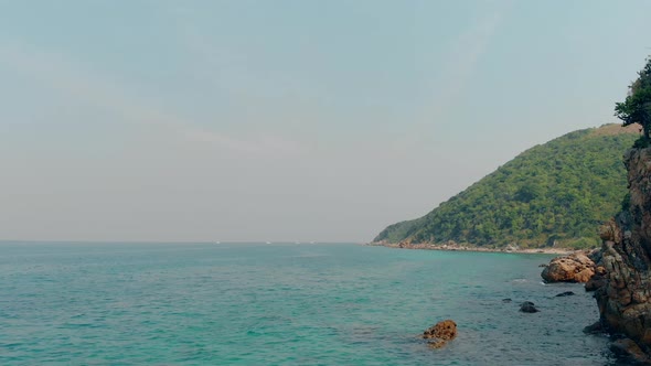 Camera Shoots Pictorial Hilly Island Washed By Azure Water alt