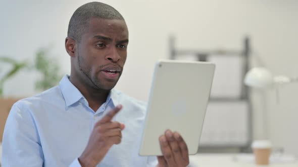 Online Video Chat Tablet By African Man alt