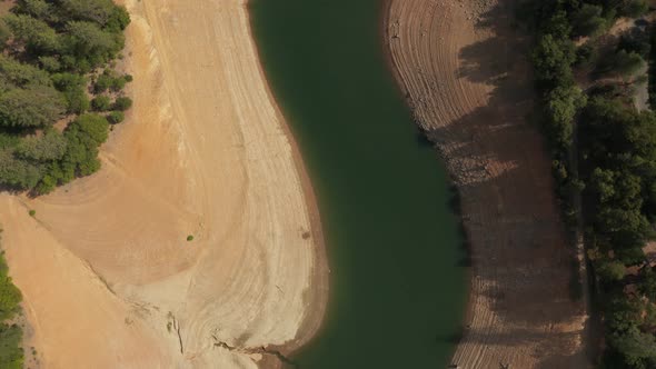 Aerial view of Shasta Lake straight down passing bridges in Northern California low water levels dur alt