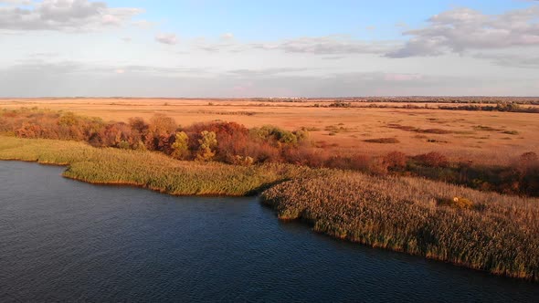 Aerial Shot Flying Over Dnipro River in Kherson Showing Reed