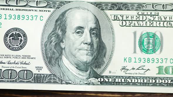 Macro shot of a 100 dollar. Benjamin Franklin as depicted on the bill