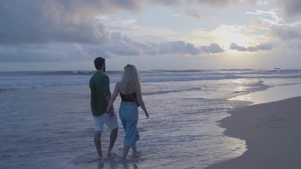 Couple Walking On Beach