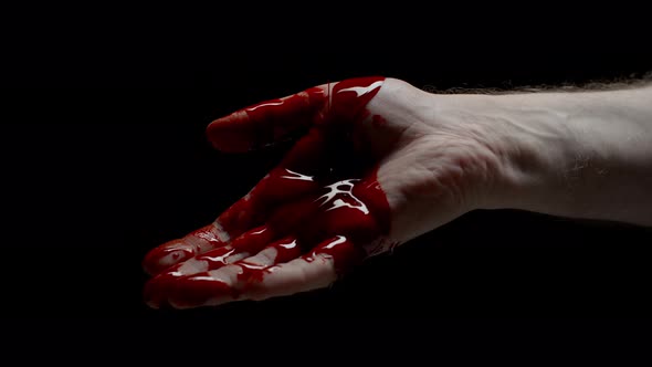 Closeup Caucasian Male Hand Covered in Blood Crime Scene Bloody Hand Isolated on Black Background alt