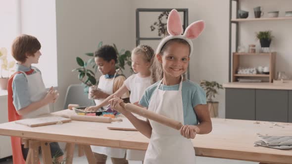 Girl with Rolling Pin Standing alt