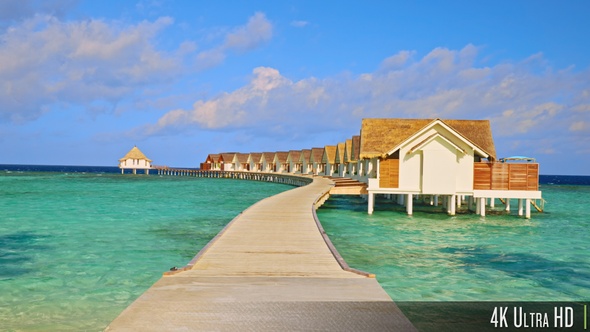 4K Walkway to luxury overwater bungalows or villas in the Maldives alt