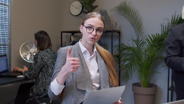 Female Business Company Manager Sitting at Office Desk Reading Resume Successful Job Interview alt