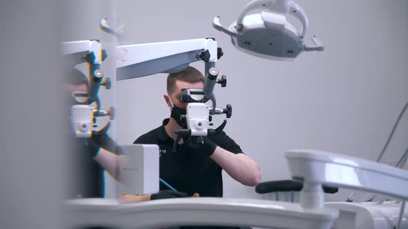 Dentist Works on Modern Equipment alt