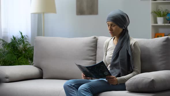 Upset Lady With Brain Cancer Looking at X-Ray Fighting for Life in Hospital alt