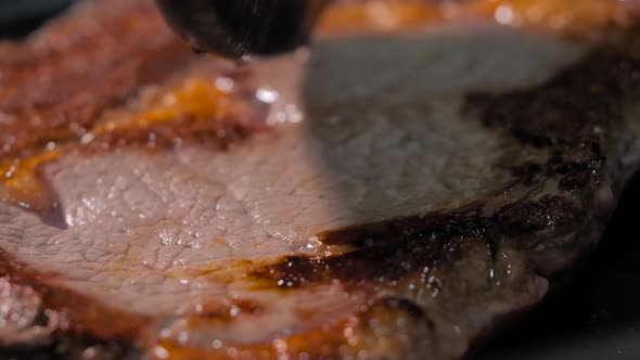 Fresh Marbled Meat Ribeye Steak Cooking in Black Frying Pan at Home  Macro