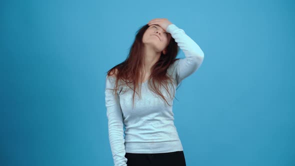 Oh No the Unpleasantly Shocked Girl Slaps Her Forehead Twice alt