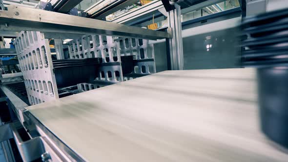 Plastic Containers Are Being Moved By the Conveyor Belt alt