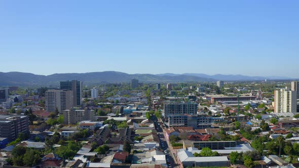 Drone Shot travel left, city ​​of talca maule septima region Chile looking at the buildings in the c alt