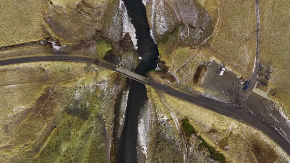 Drone Over Bridge Crossing Fjaora River In Fjaorargljufur Canyon alt