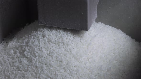 Plastic Granules Fill the Tank for Further Sorting alt