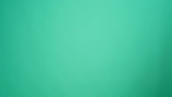 Courier in Gloves Passing Craft Shopping Bag with Delivery Against Mint Background alt