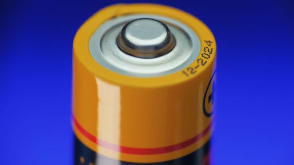 Alkaline Batteries Rotates On The Blue Background