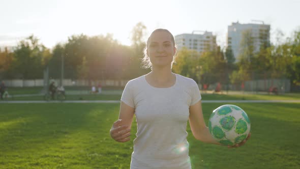 Portrait of Woman Football Player in Tshort in the Park